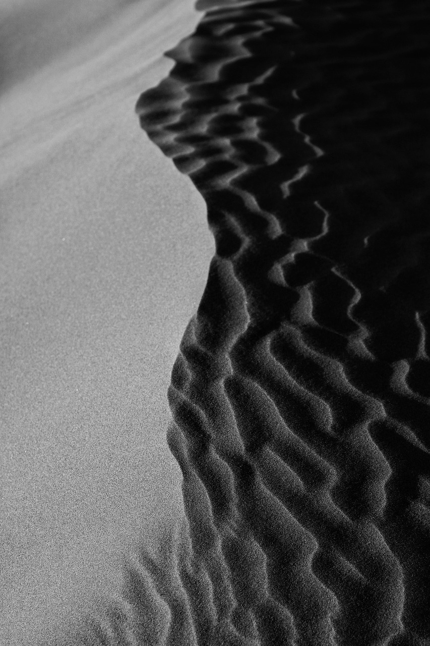 Rippled sand in hard light and shadow